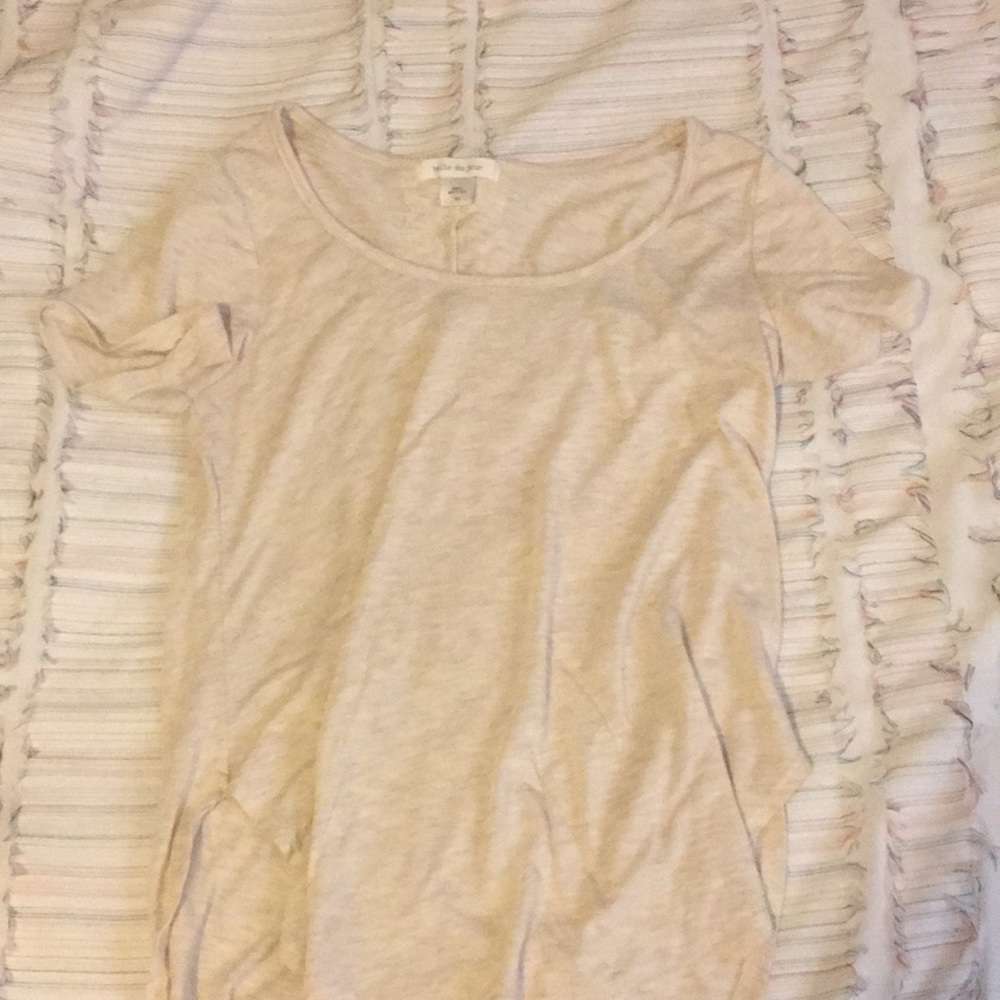 Tan short sleeve tee w/ a lace backing.